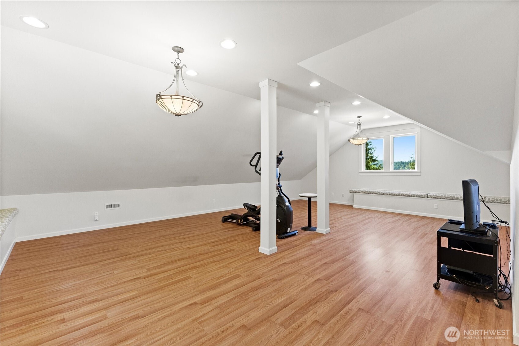 89 Grand View Lane Bellingham, WA 98229 - Photo 26 of 40 a view of a room with wooden floor and a ceiling fan