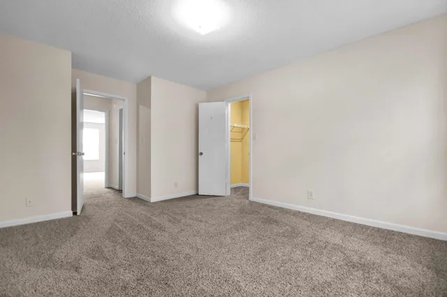 an empty room with closet area