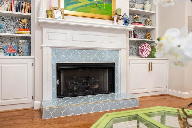 a living room with furniture chandelier and a table