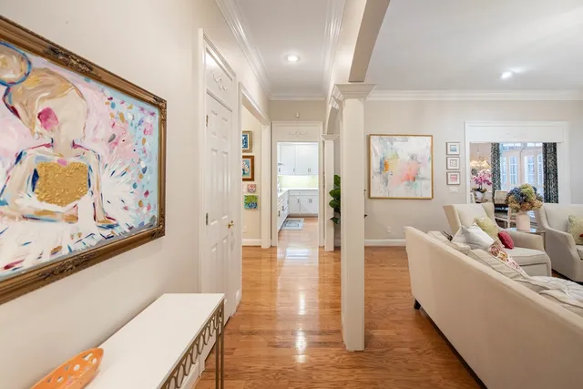 a kitchen with granite countertop white cabinets and stainless steel appliances