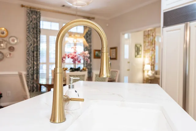 a bathroom with a granite countertop sink a toilet and a bathtub