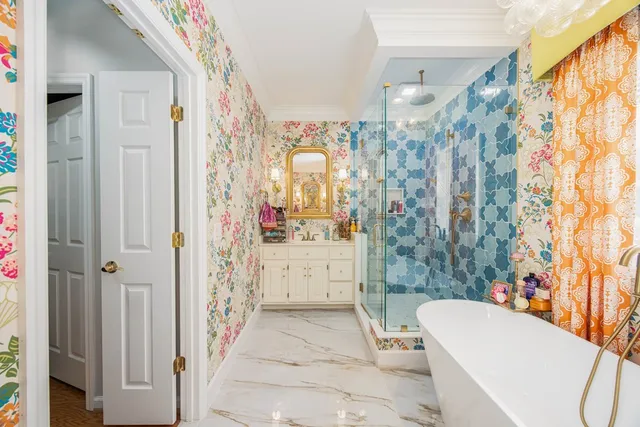 a bathroom with a sink and mirror with toilet