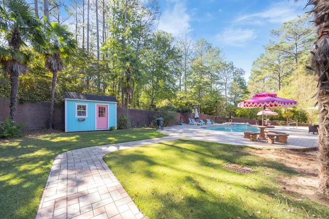 a spacious bedroom with a bed and glass window