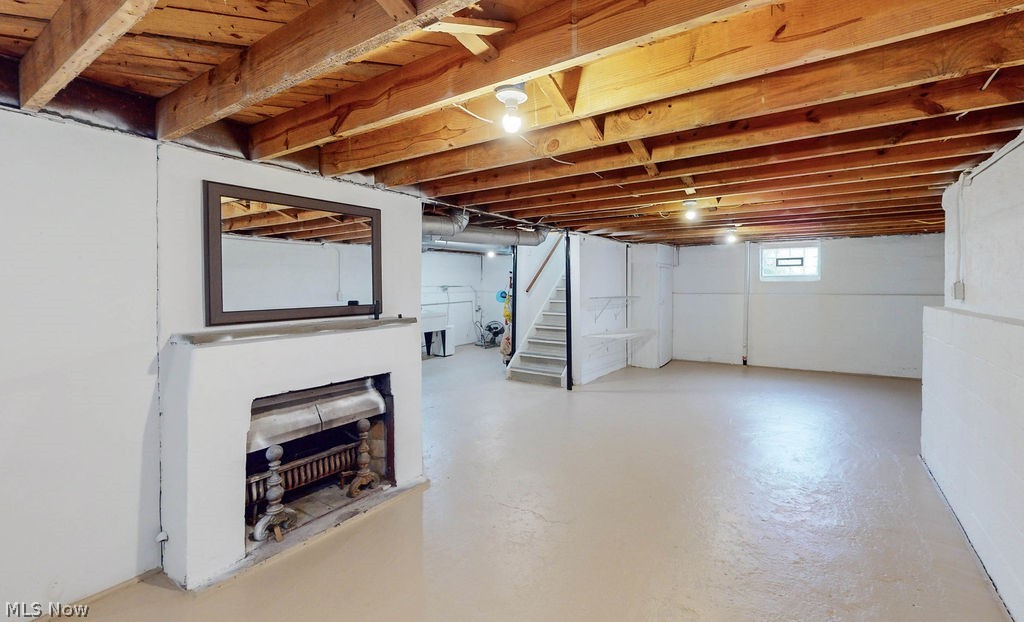1200 Winston Road Cleveland, OH 44121 - Photo 24 of 35 Unfinished basement that is clean and usable with non-operating fireplace.