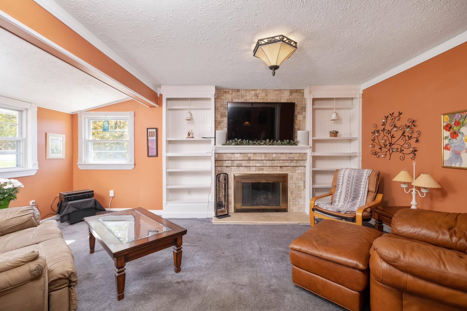 1845 Mt Torrey Road Lyndhurst, VA 22952 - Photo 5 of 27 a living room with furniture a flat screen tv and a fireplace