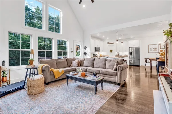 a living room with furniture and a large window