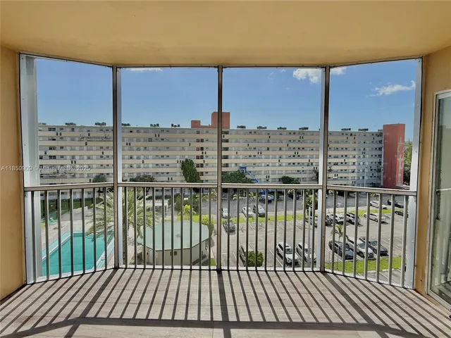 a view of a balcony with wooden floor