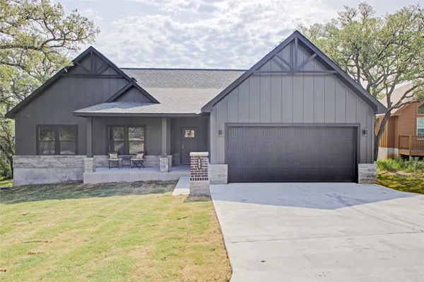a view of house with swimming pool outdoor seating