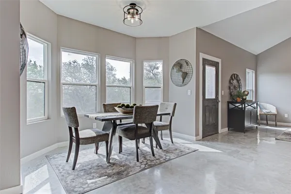 a kitchen with kitchen island a sink stainless steel appliances and cabinets