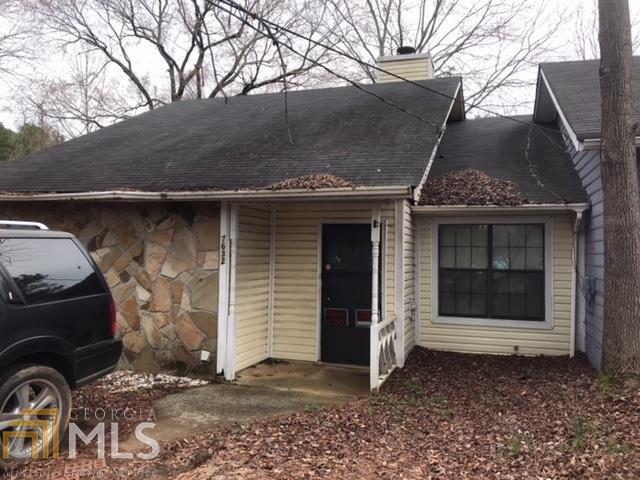 7632 Tara Road, Unit 4 Jonesboro, GA 30236 - Photo 1 of 1 a front view of a house with parking space