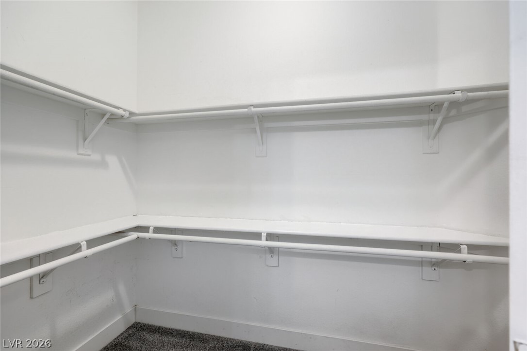 5985 High Steed Street, Unit 101 Henderson, NV 89011 - Photo 27 of 38 Well-organized closet with ample shelving and hanging rods.
