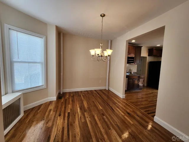 a view of a livingroom with wooden floor
