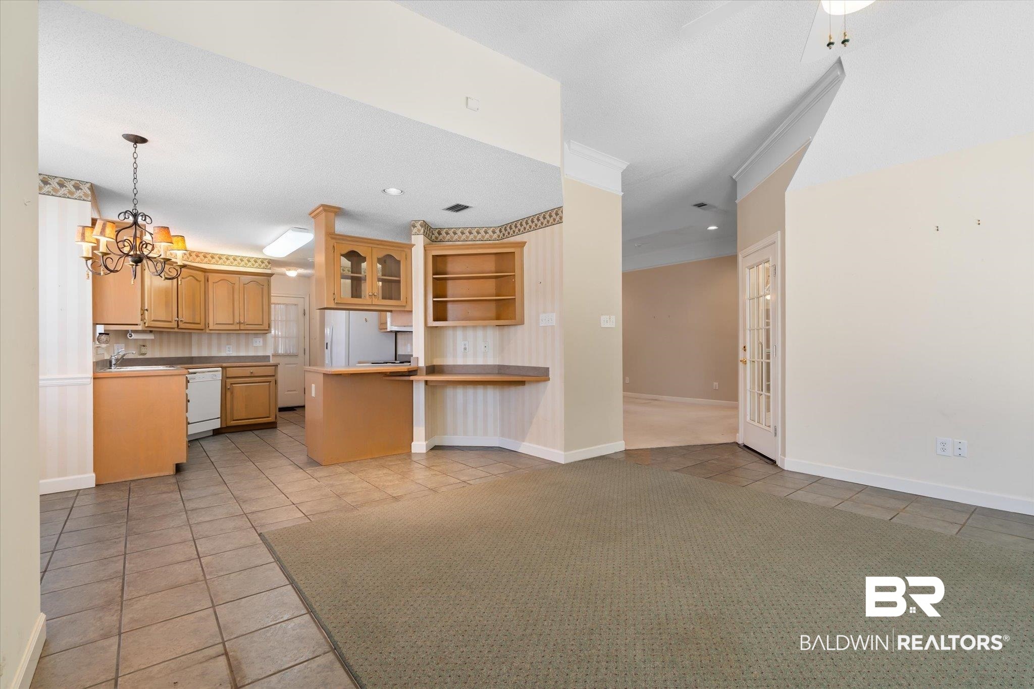 2220 Irongate Court Mobile, AL 36695 - Photo 8 of 20 Kitchen featuring white appliances, light tile patterned flooring, a notable chandelier, and open shelves