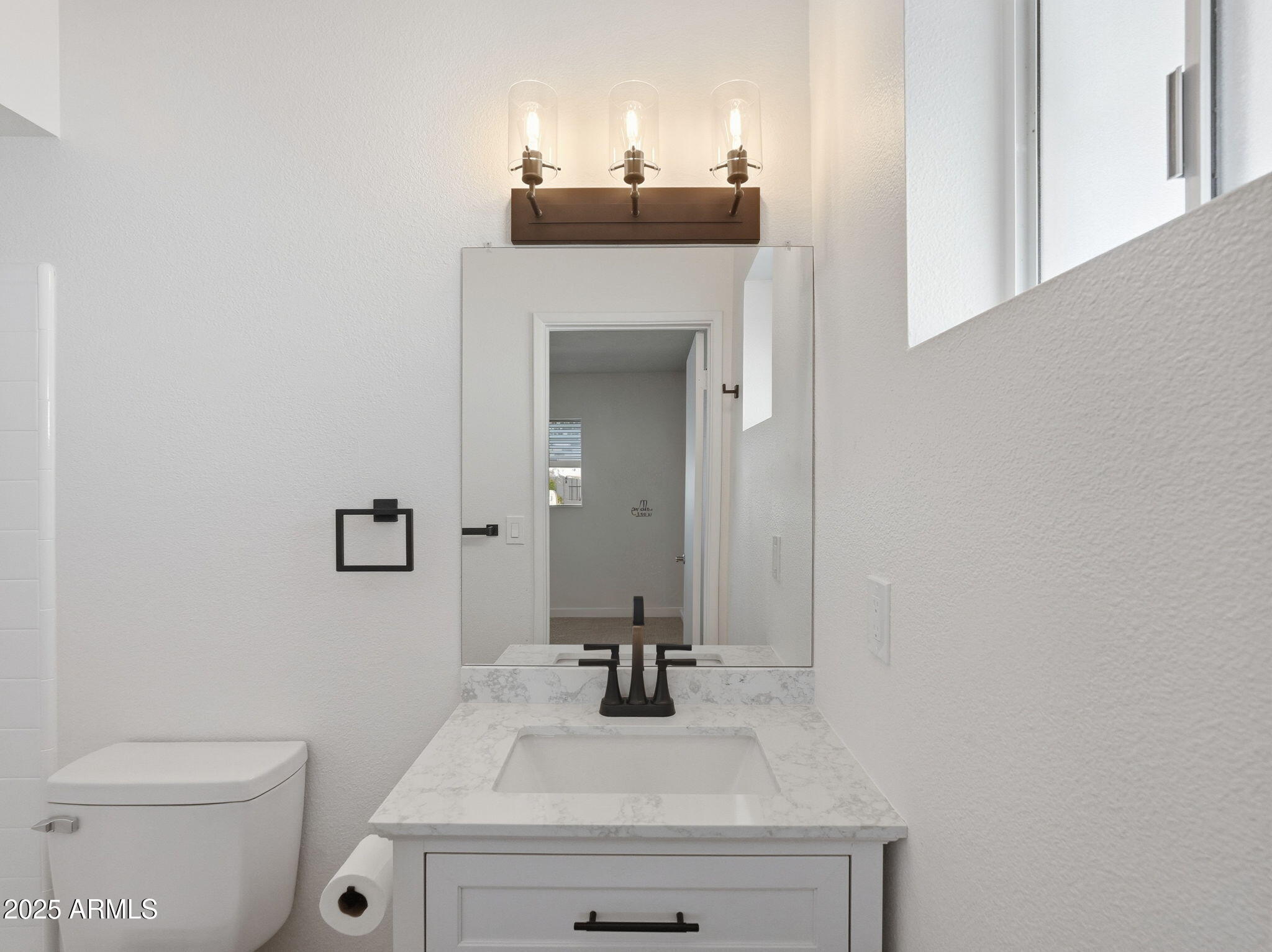 1428 South Palo Verde Drive Apache Junction, AZ 85120 - Photo 23 of 37 a bathroom with a sink vanity mirror and toilet