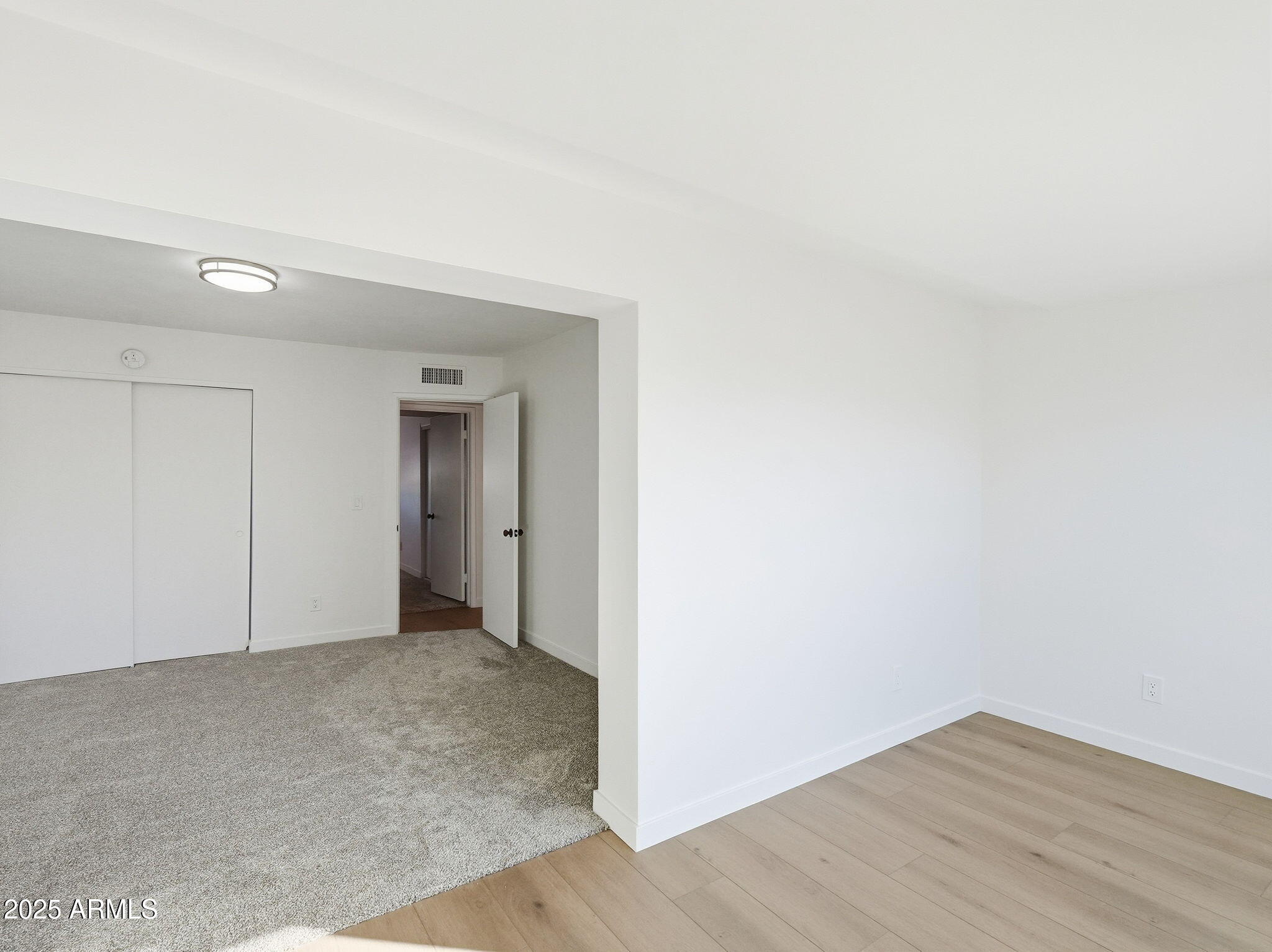 1428 South Palo Verde Drive Apache Junction, AZ 85120 - Photo 27 of 37 a view of an empty room and wooden floor