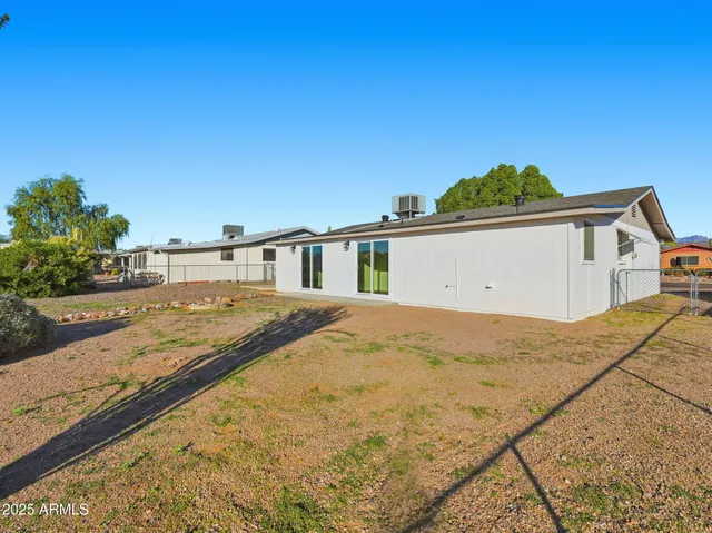 a view of the house with basketball court