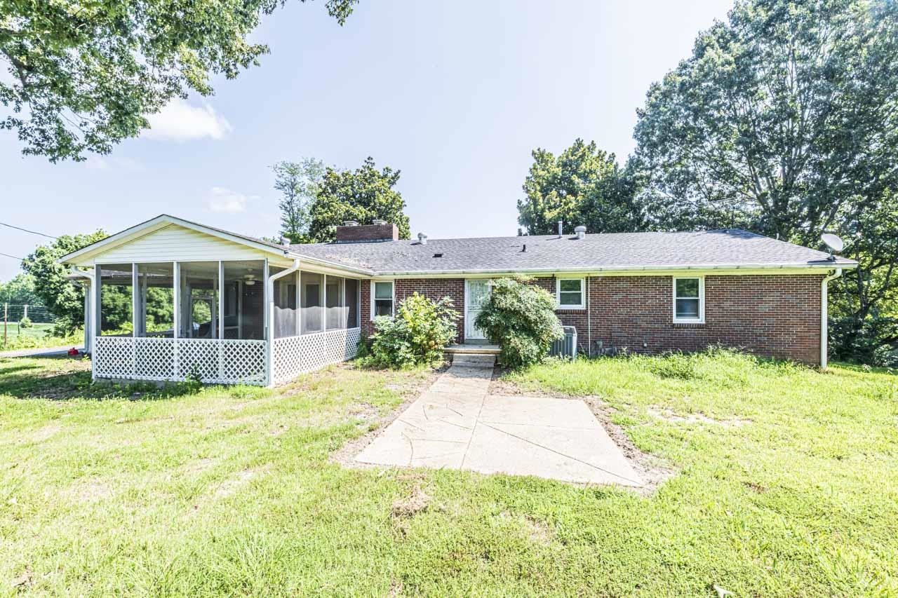 725 Old Brownsville Road Ripley, TN 38063 - Photo 32 of 40 a view of a house with a yard and potted plants