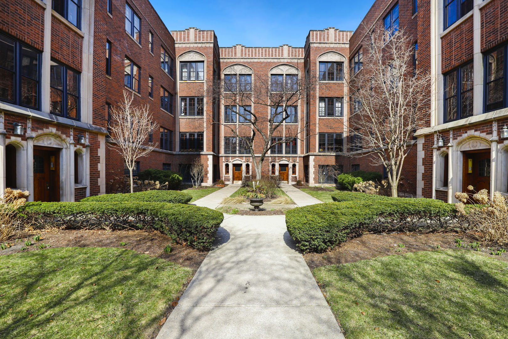 a view of a building with a yard