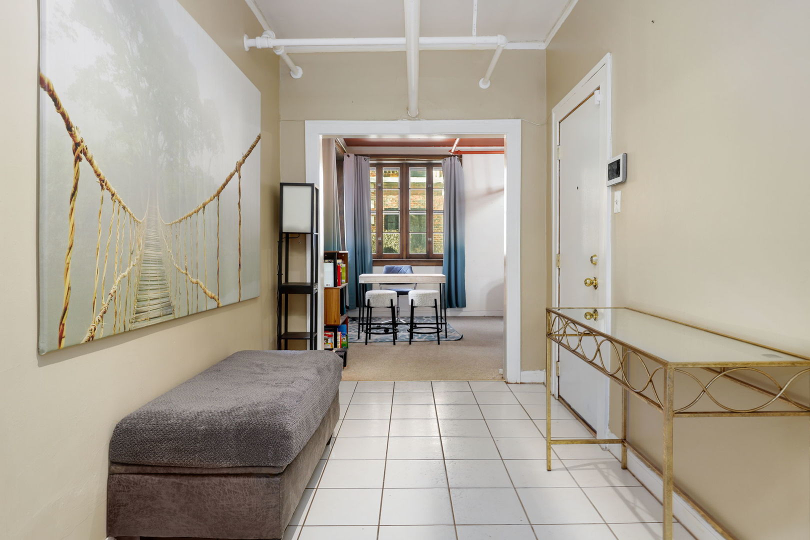 1360 East Madison Park, Unit B Chicago, IL 60615 - Photo 2 of 25 a dining room with furniture and a window