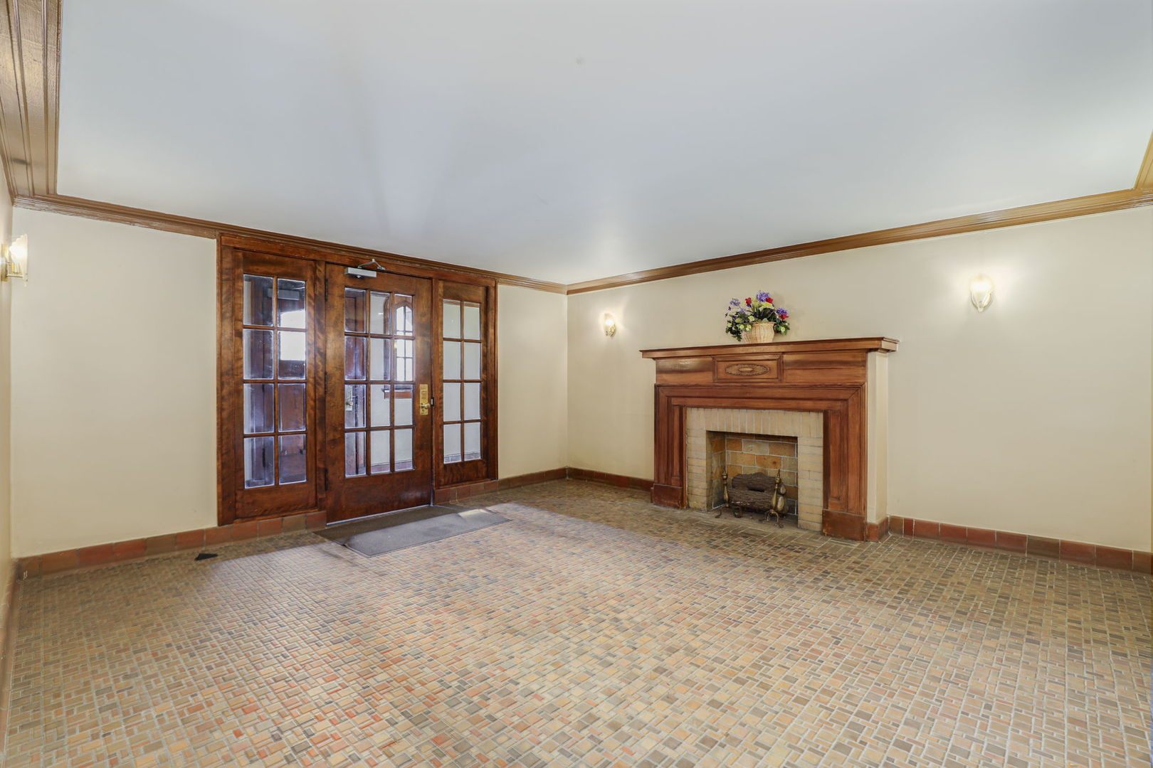 1360 East Madison Park, Unit B Chicago, IL 60615 - Photo 22 of 25 a view of an empty room with a fireplace and a window