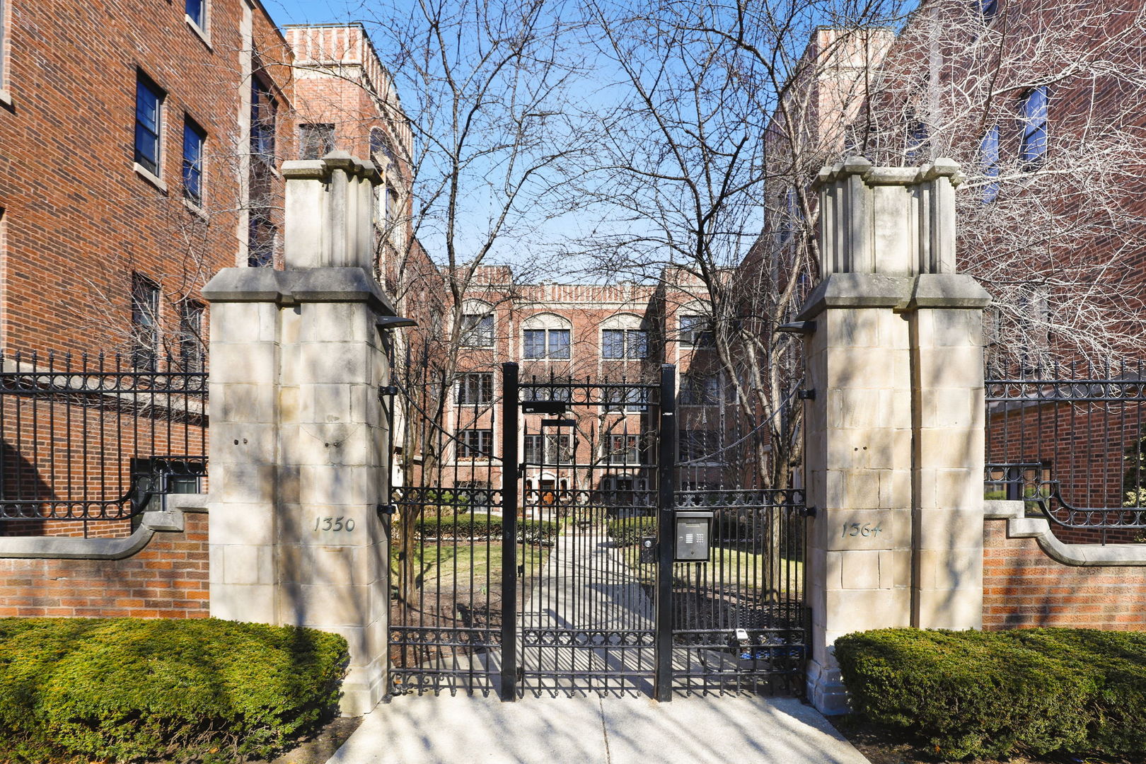 1360 East Madison Park, Unit B Chicago, IL 60615 - Photo 23 of 25 a city street lined with tall buildings
