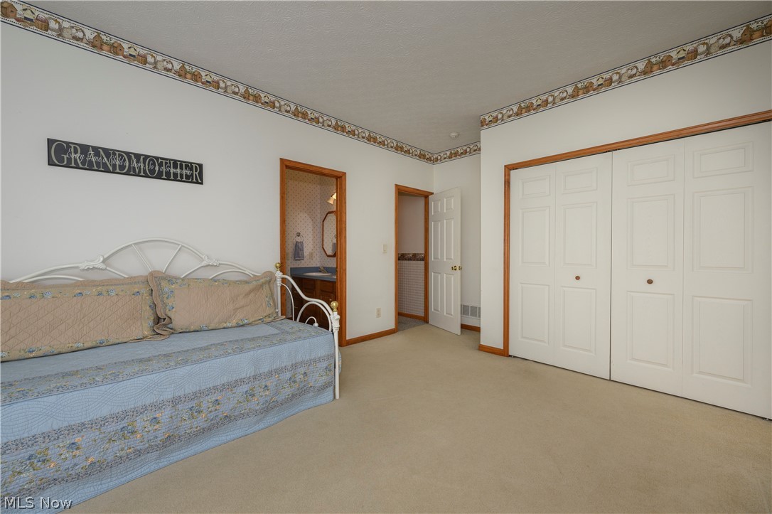 8745 Broadview Road Broadview Heights, OH 44147 - Photo 16 of 49 Spacious room with plush carpeting, natural wood trim, and bi-fold closet doors