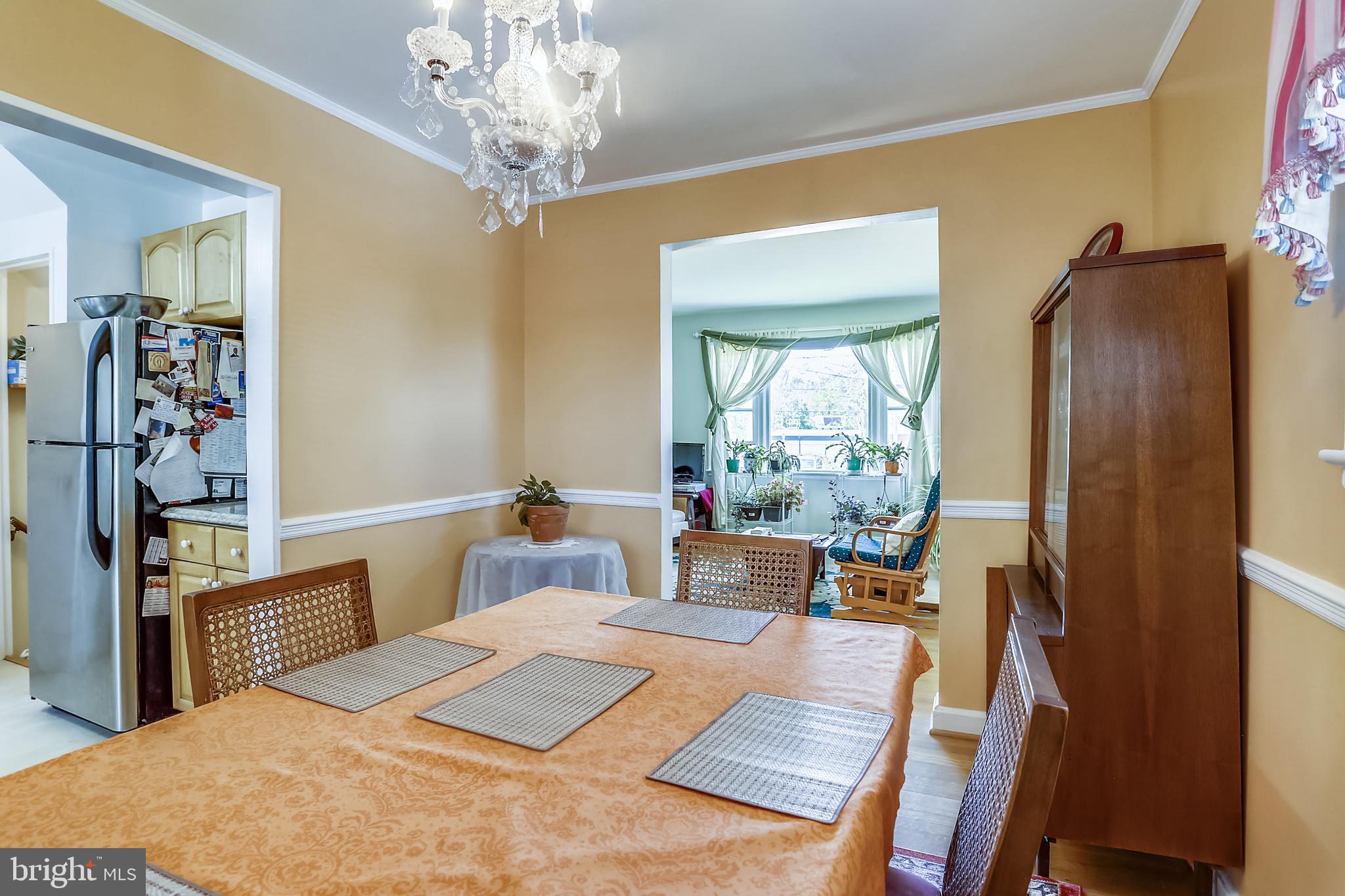 3115 Medway Street Silver Spring, MD 20902 - Photo 7 of 43 a bedroom with a bed and a chandelier