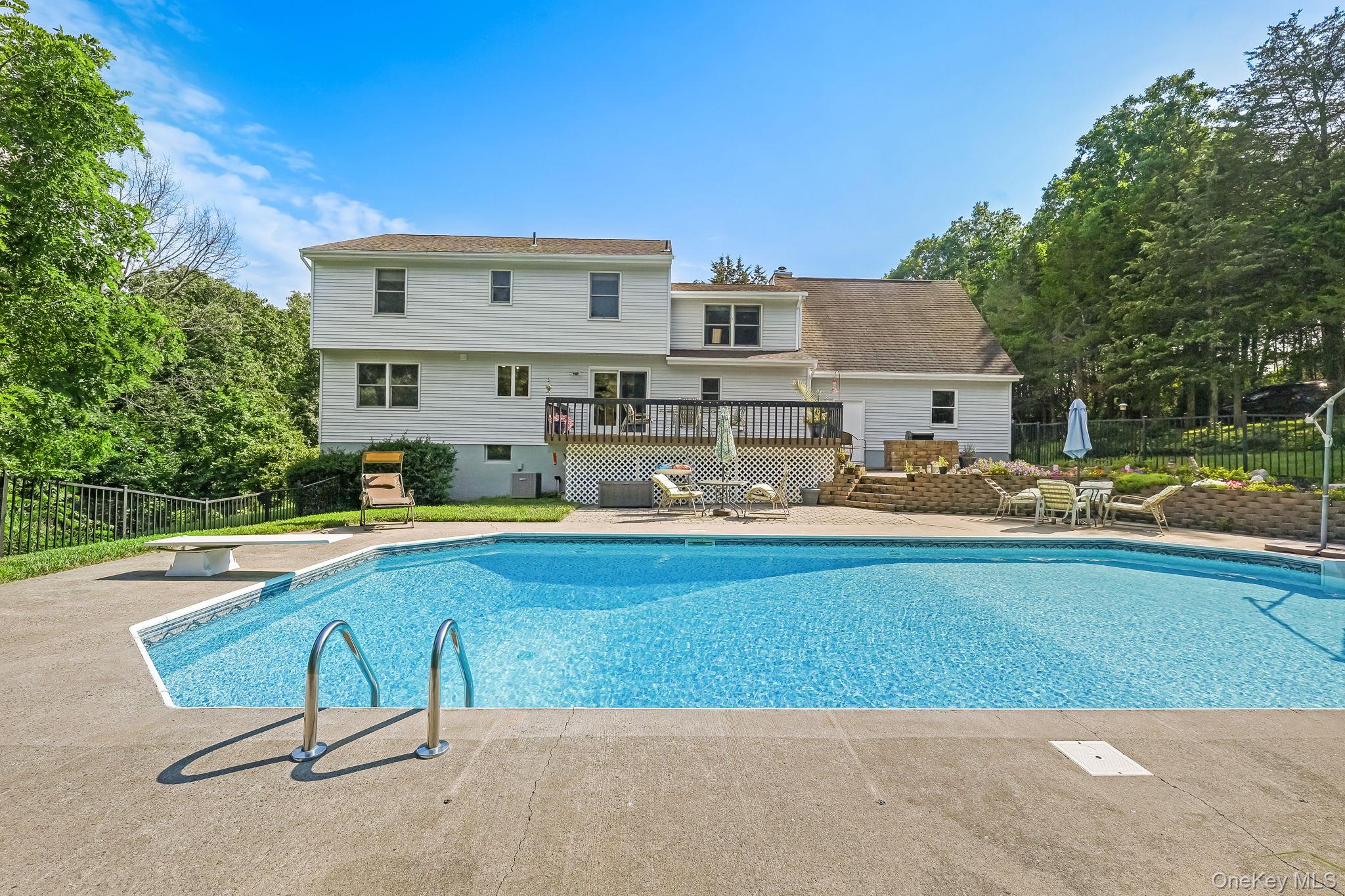 185 Rombout Road Pleasant Valley, NY 12569 - Photo 12 of 49 a swimming pool with outdoor seating and yard