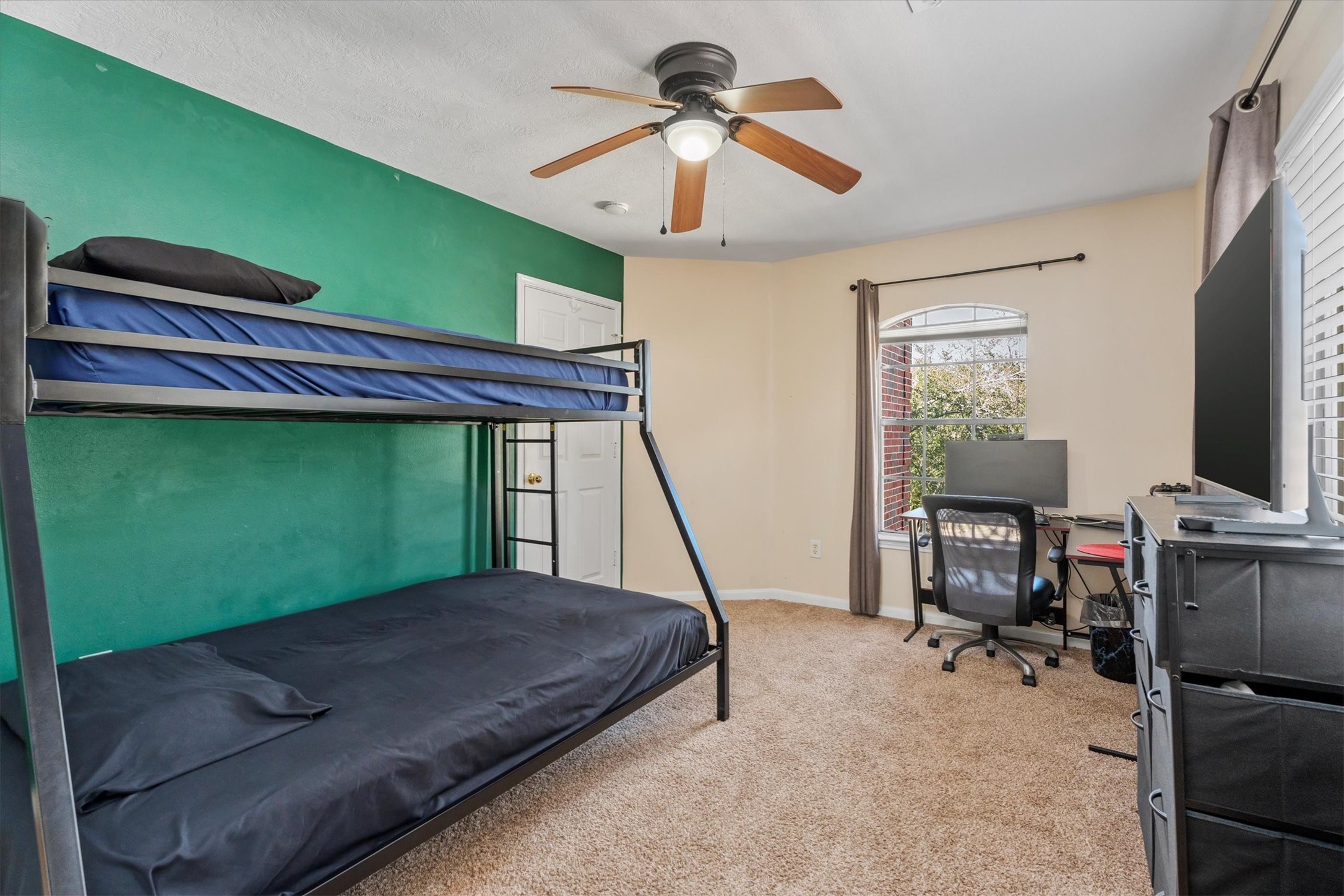3315 La Seine Lane Spring, TX 77388 - Photo 26 of 31 a bedroom with a bed and a chandelier