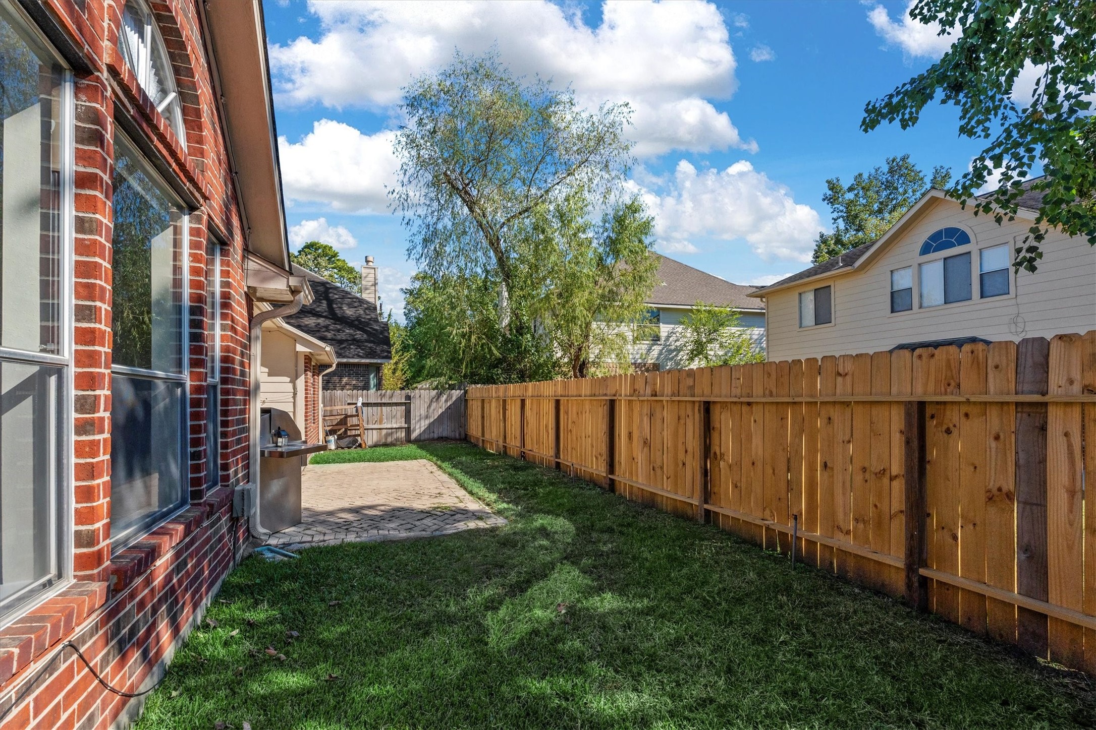 3315 La Seine Lane Spring, TX 77388 - Photo 30 of 31 a view of backyard with a garden and wooden fence