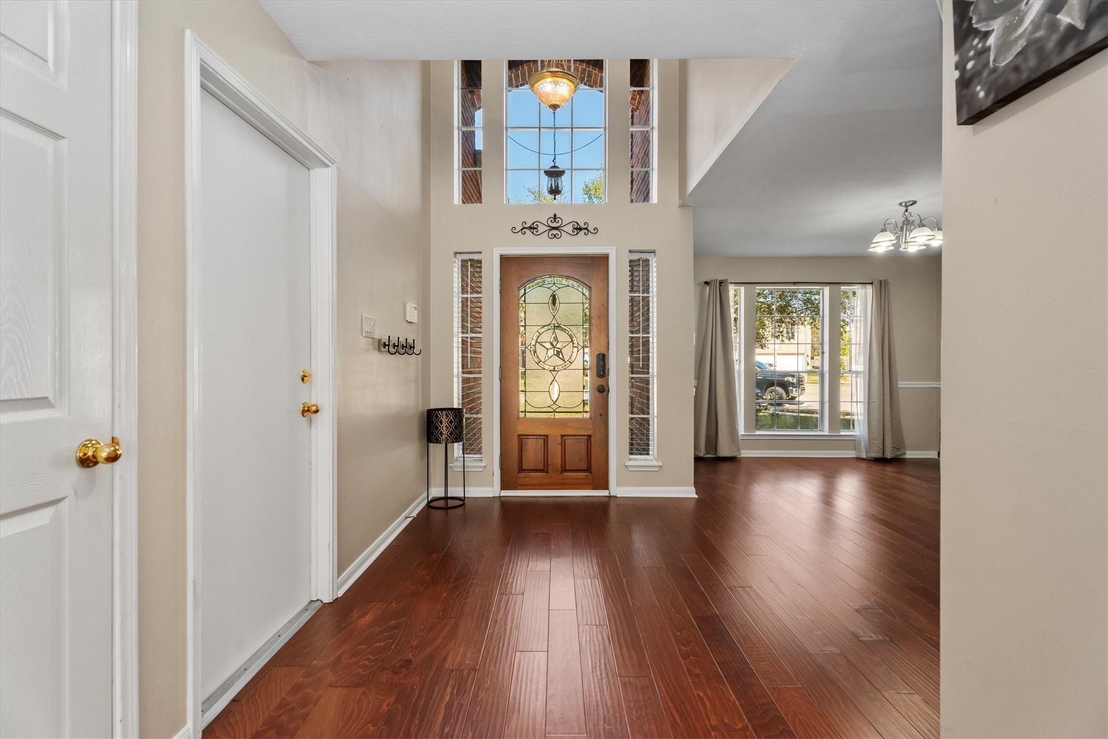 3315 La Seine Lane Spring, TX 77388 - Photo 5 of 31 a view of a hallway with wooden floor windows and entryway