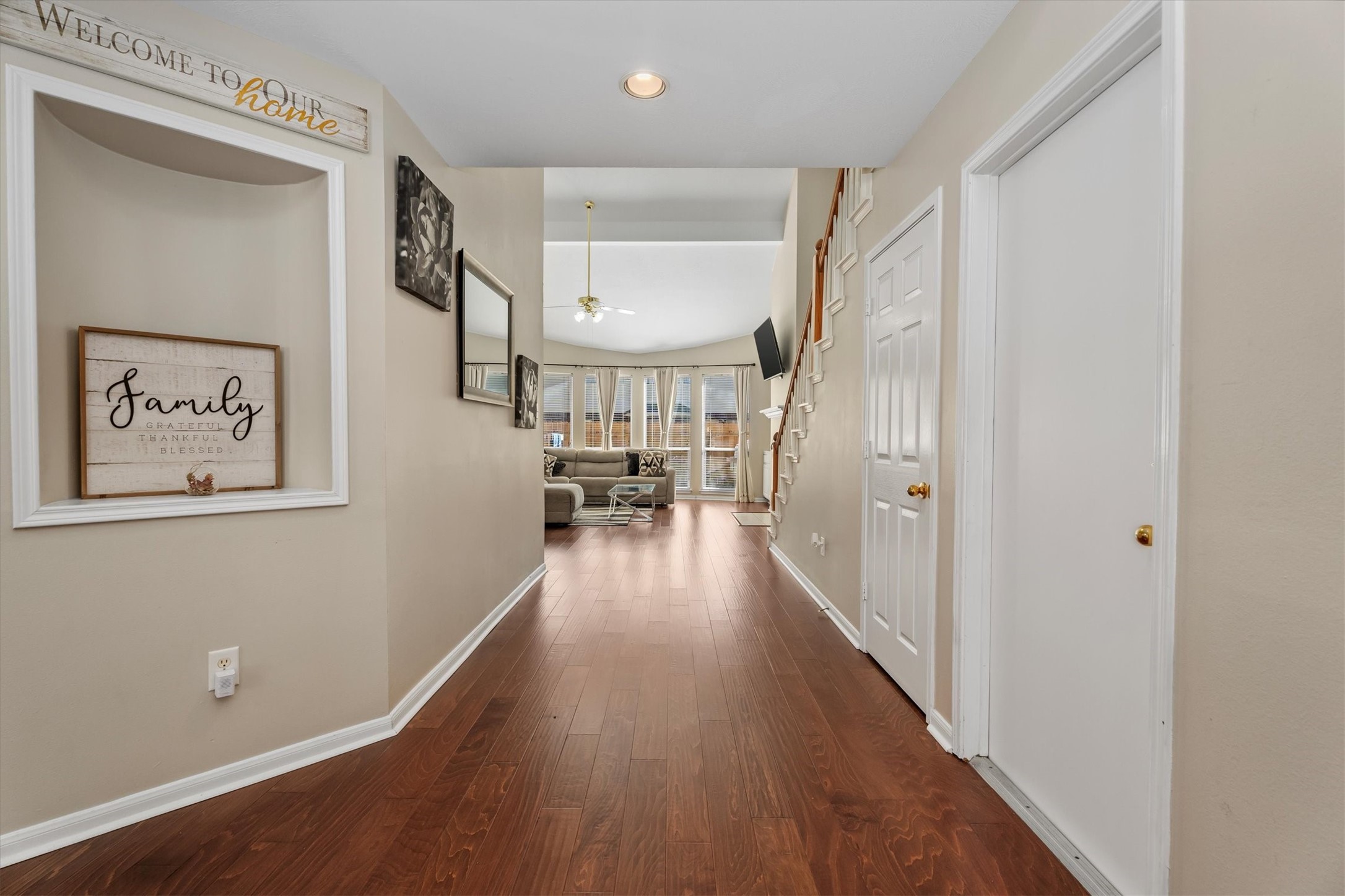 3315 La Seine Lane Spring, TX 77388 - Photo 6 of 31 a view of a hallway with wooden floor and a living room