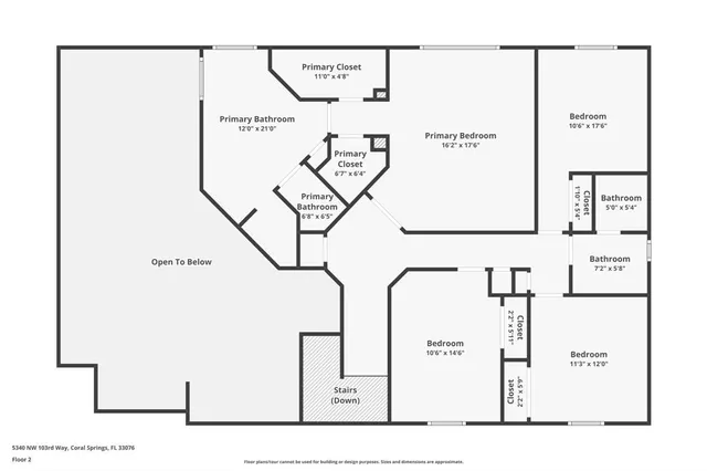 a front view of a house with a garden and plants