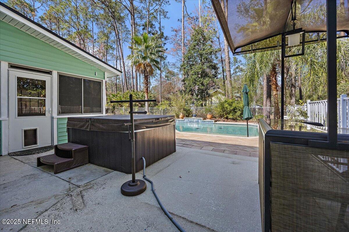 415 Bald Eagle Road Fleming Island, FL 32003 - Photo 24 of 27 a living room with patio furniture