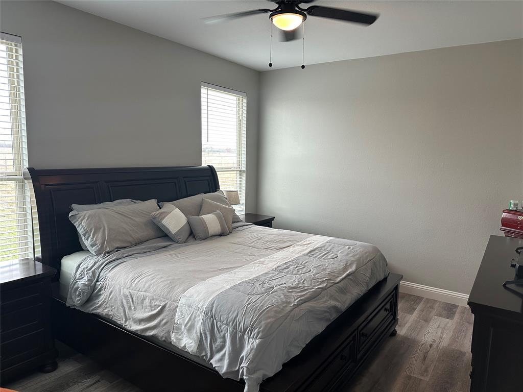 4760 County Road 4603 Commerce, TX 75428 - Photo 12 of 36 a bedroom with a bed and a window