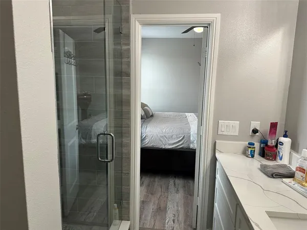 a bathroom with a sink and mirror
