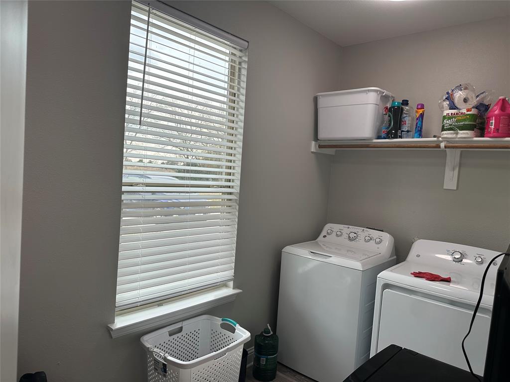 4760 County Road 4603 Commerce, TX 75428 - Photo 17 of 36 a room with a window and washer