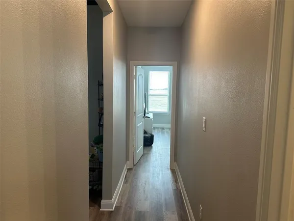 a view of a bathroom from the hallway