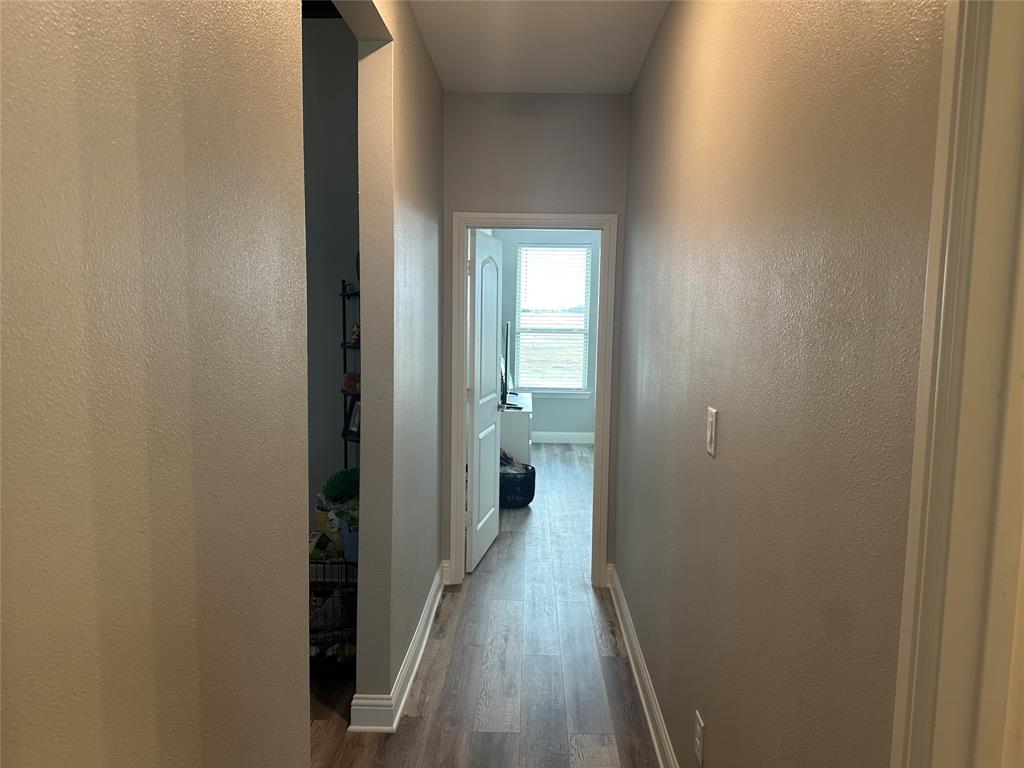 4760 County Road 4603 Commerce, TX 75428 - Photo 21 of 36 a view of a bathroom from the hallway