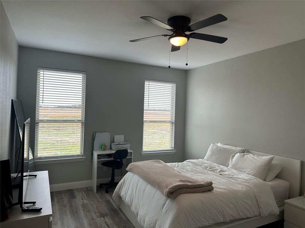 4760 County Road 4603 Commerce, TX 75428 - Photo 22 of 36 a bedroom with a bed and a window