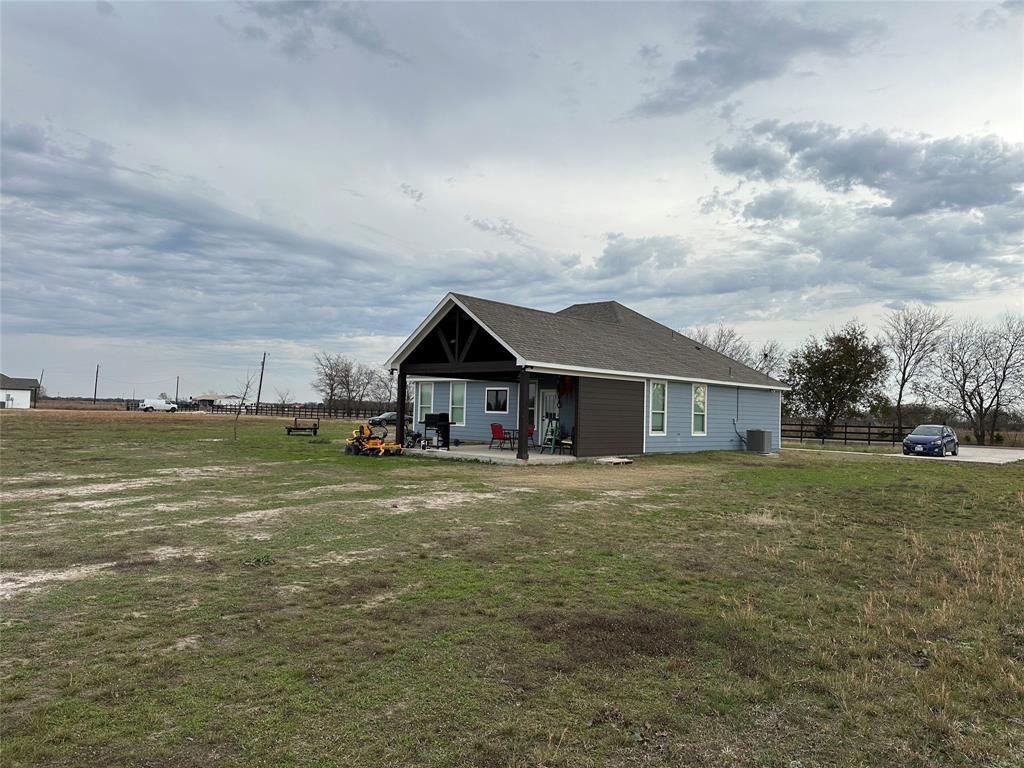4760 County Road 4603 Commerce, TX 75428 - Photo 28 of 36 a front view of a house with a yard