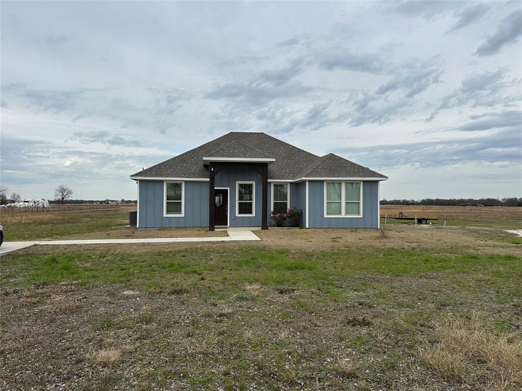 4760 County Road 4603 Commerce, TX 75428 - Photo 3 of 36 a front view of a house with garden