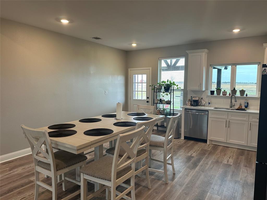 4760 County Road 4603 Commerce, TX 75428 - Photo 10 of 36 a view of a dining room with furniture and window