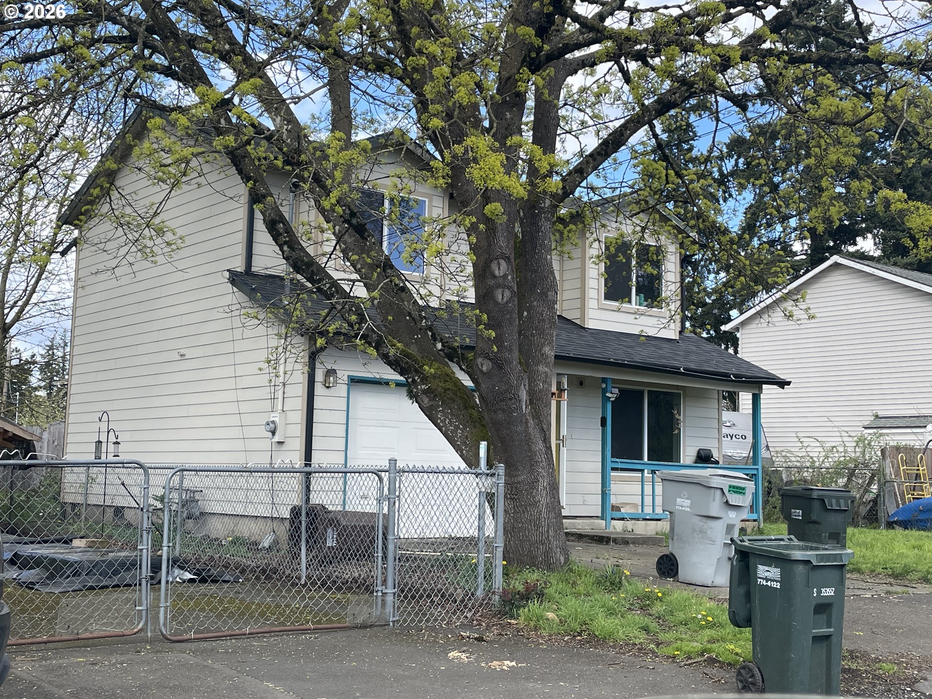8321 Southeast Gray Street Happy Valley, OR 97086 - Photo 2 of 3 a front view of a house with garden