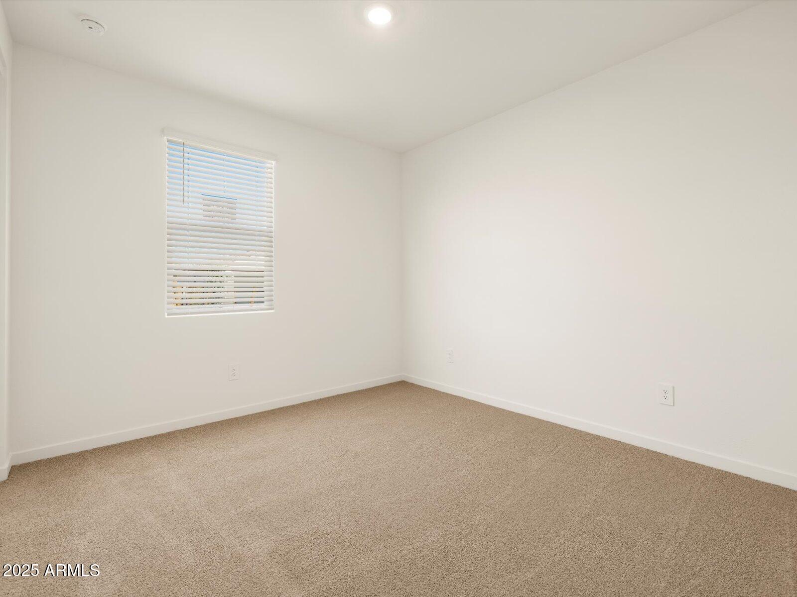 2426 Grenache Road San Tan Valley, AZ 85143 - Photo 14 of 73 an empty room with a window