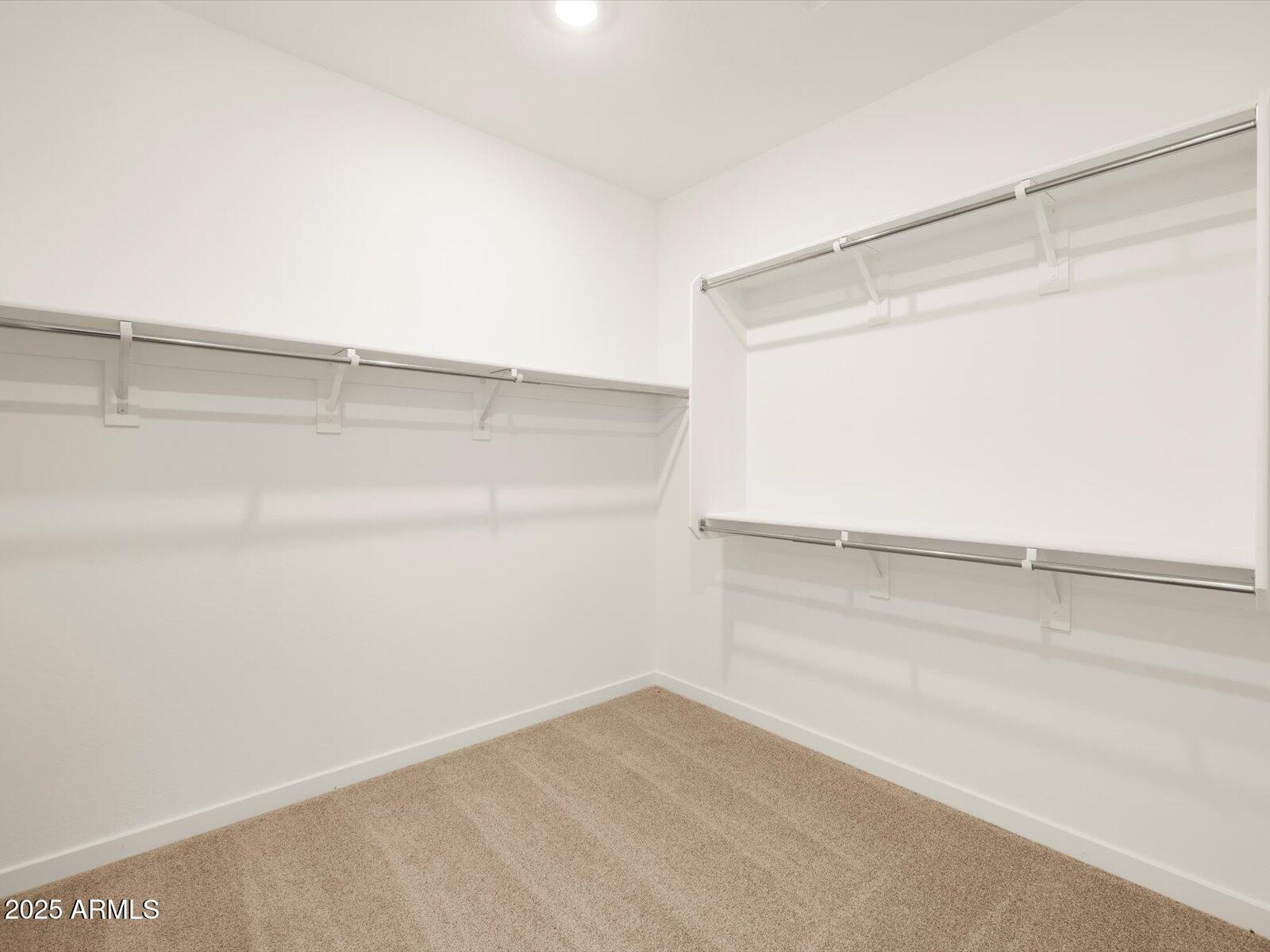 2426 Grenache Road San Tan Valley, AZ 85143 - Photo 18 of 73 a view of an empty walk in closet