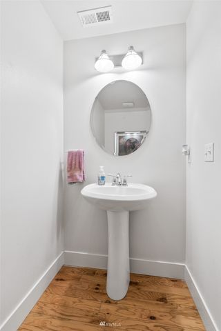 a bathroom with a sink and mirror