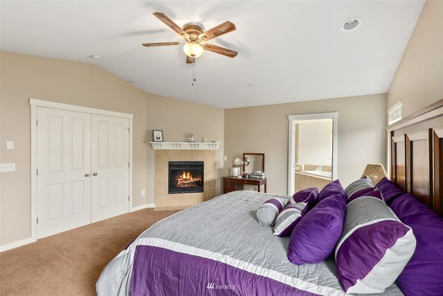 a bed room with a bed and a fireplace