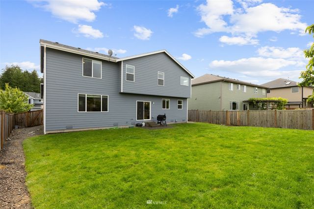 a house view with a backyard space