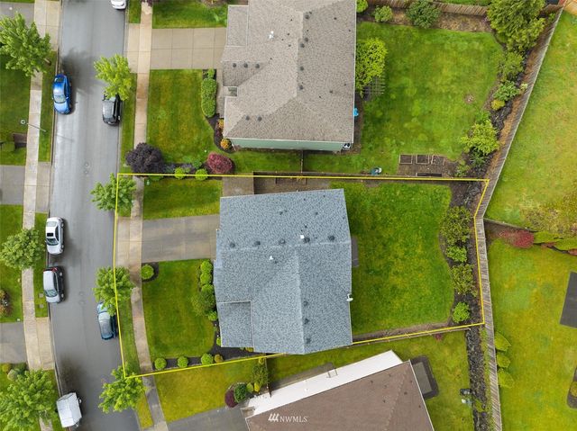 an aerial view of a house with a garden